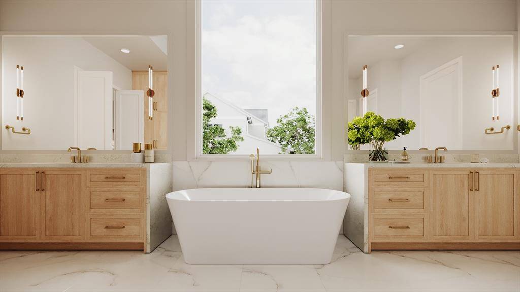 Primary Bath with Dual Counters, White Oak Inset Cabinetry, Framed Mirrors, Pendent Lighting, 71" Freestanding Soaking Tub with a Floor Mounted Tub Filler.