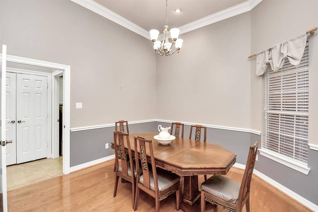 Elegant dining room with soaring 12-foot ceilings, seamlessly connected to the spacious living area.