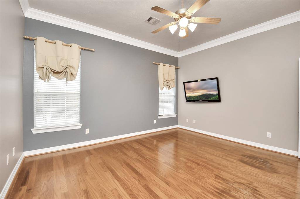 Bright and inviting primary bedroom with abundant natural light.