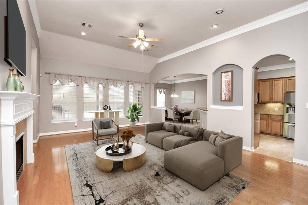 This modern kitchen includes granite countertops, stainless steel appliances, and abundant wooden cabinetry. Enjoy a gas cooktop, built-in oven, and spacious tile flooring for a perfect cooking experience. Added bonus, the refrigerator stays with the home!