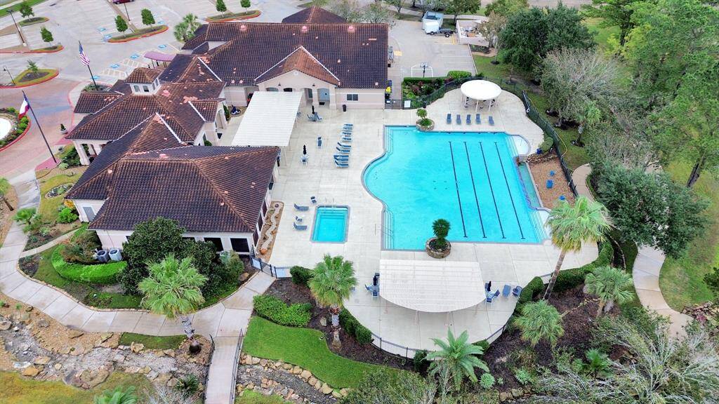 Discover a welcoming and secure community with a gated entrance, charming guardhouse, and lush landscaping, ensuring peace and safety for residents.