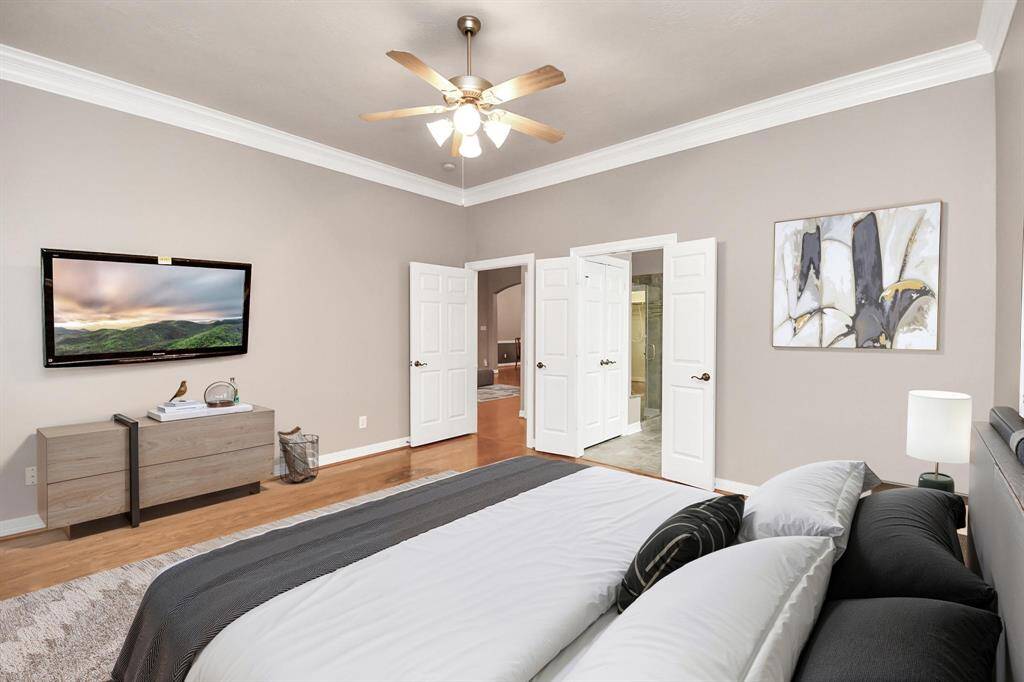 Virtually Staged - Cozy front bedroom with a spacious closet, ideal for guests.