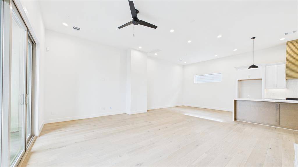Living room towards dining room and kitchen