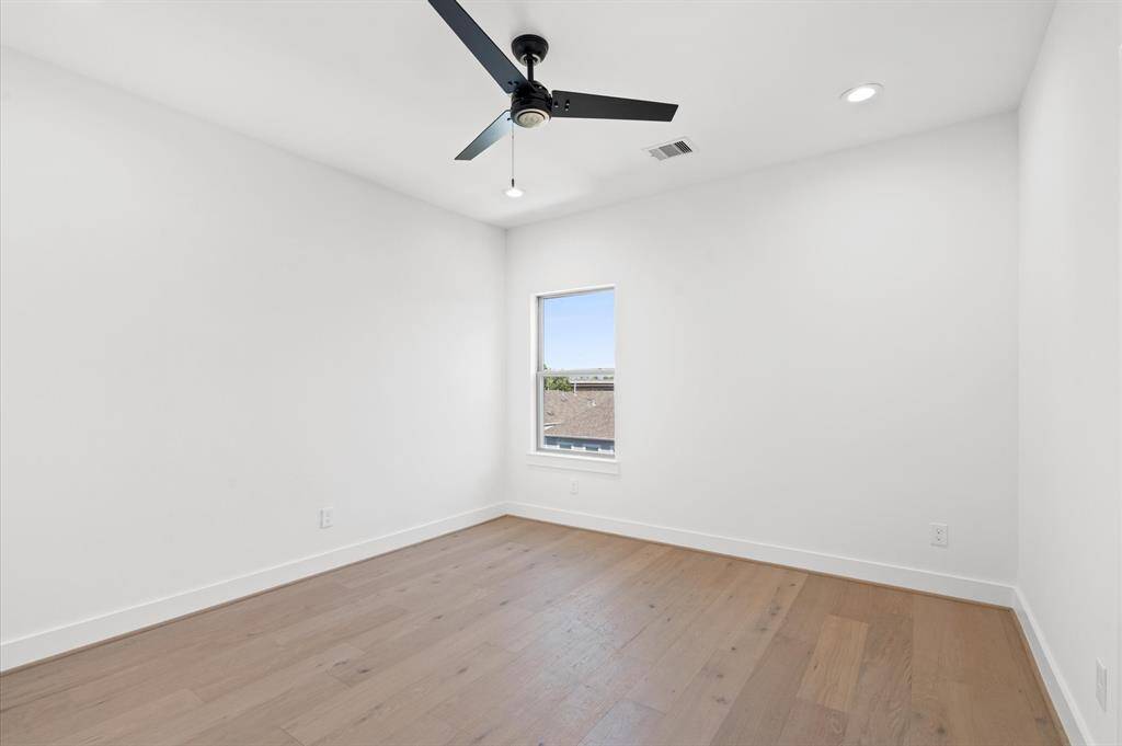 Secondary spacious bedroom on 3rd floor.Previous home by builder. Finishes may vary.