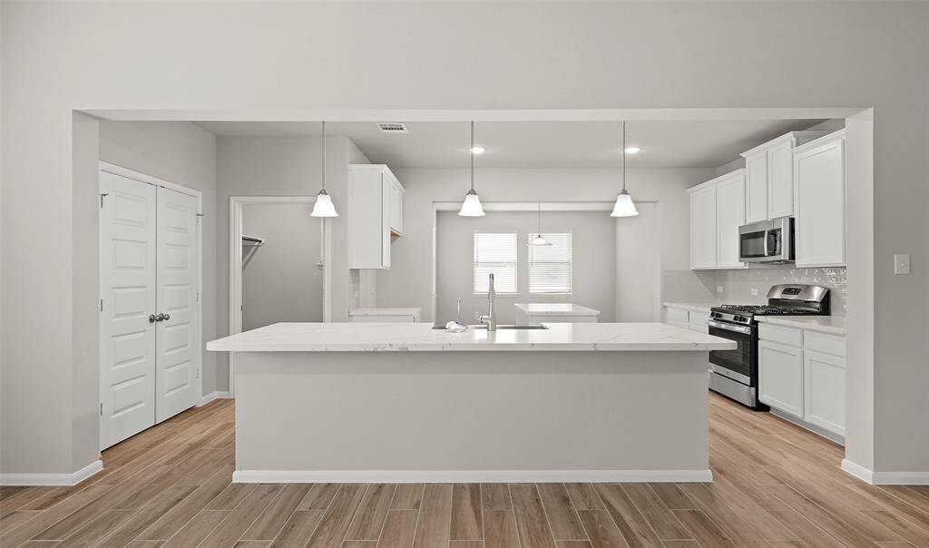 Beautiful gourmet kitchen with quartz countertops (*Photo not of actual home and used for illustration purposes only.)