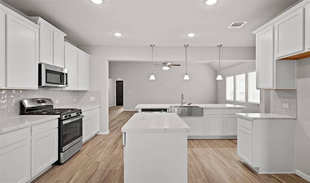 Island kitchen (*Photo not of actual home and used for illustration purposes only.)