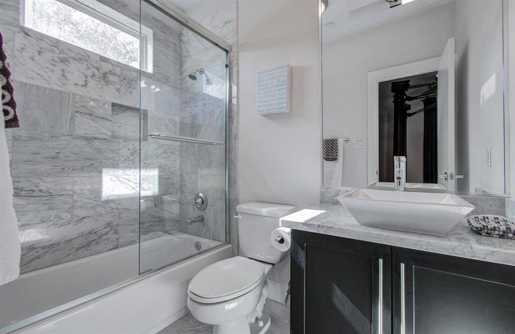 Granite countertops and modern details in the 1st floor ensuite bathroom.