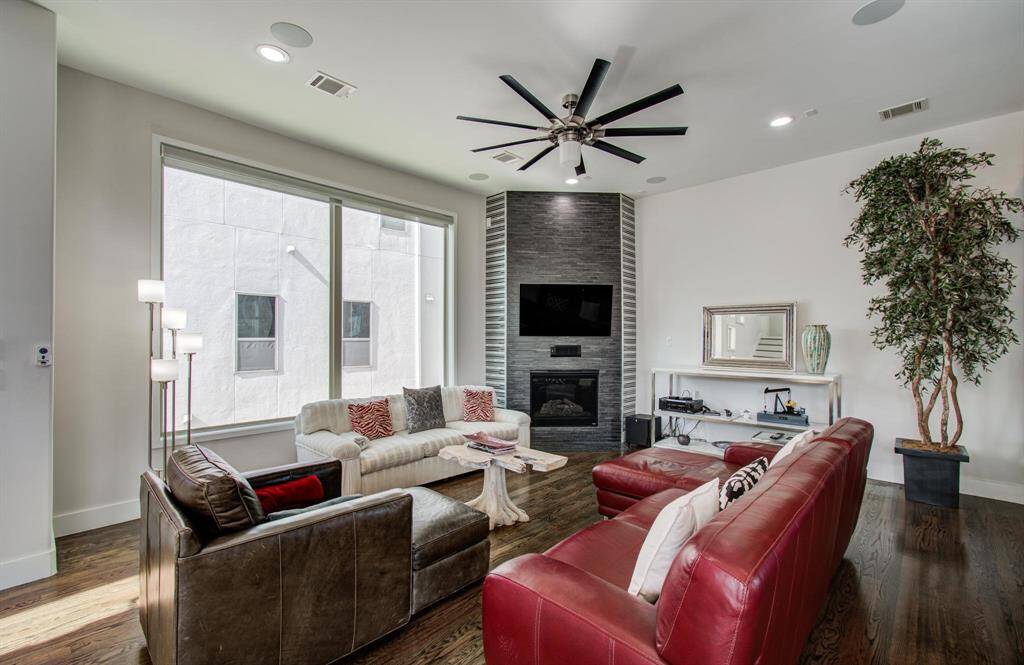 A cozy fireplace is the center of this large living space on the 2nd floor.