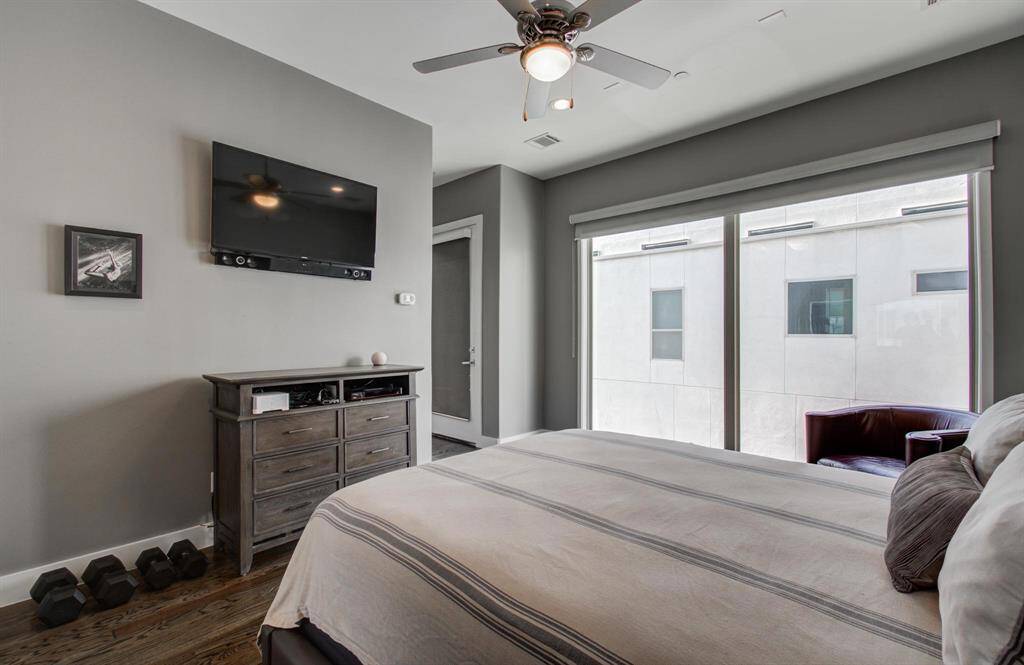 Primary bedroom with floor to ceiling windows and your very own balony.