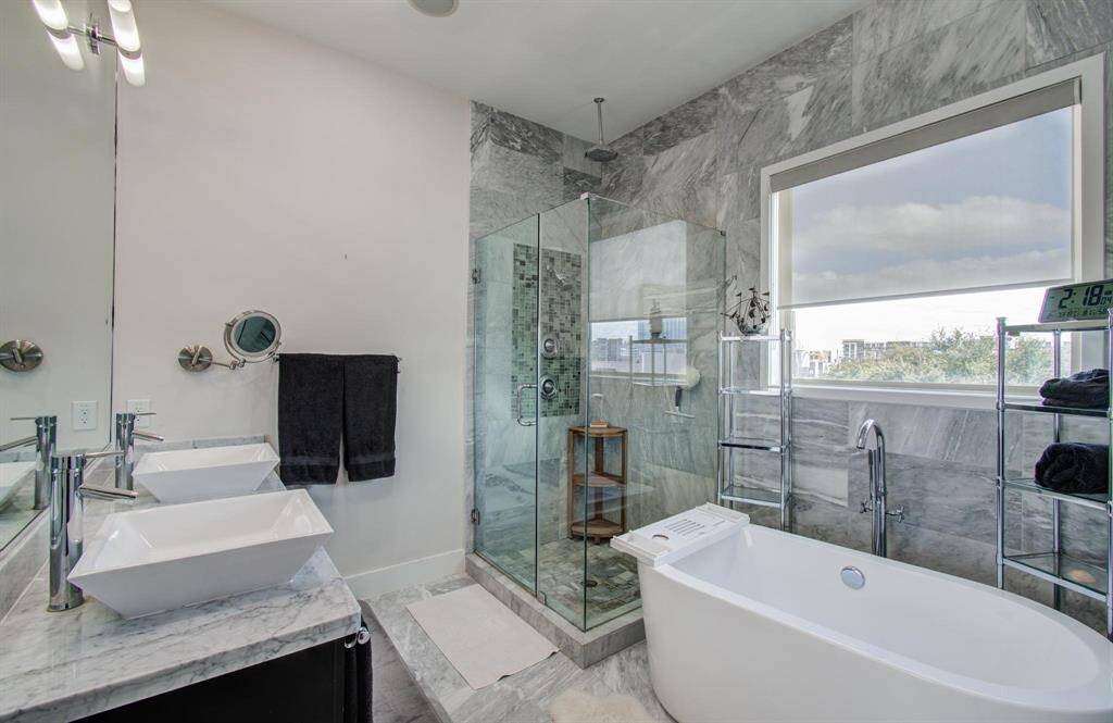 Check out this primary bathroom! Double sinks, separate soaking tub and walk in shower.