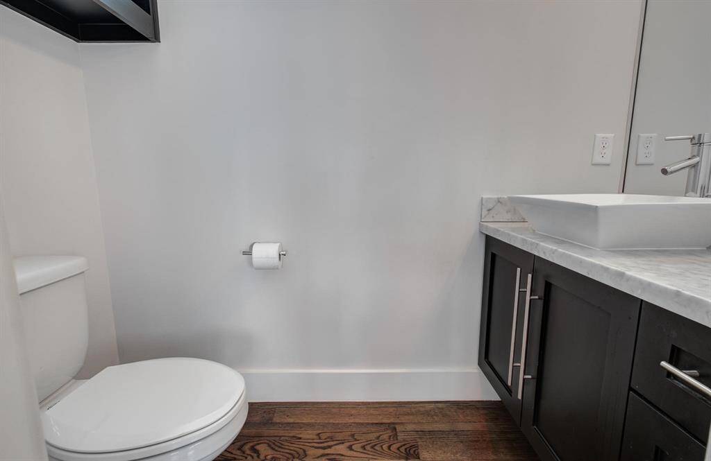 One of two half bathrooms, this one located on the 4th floor.
