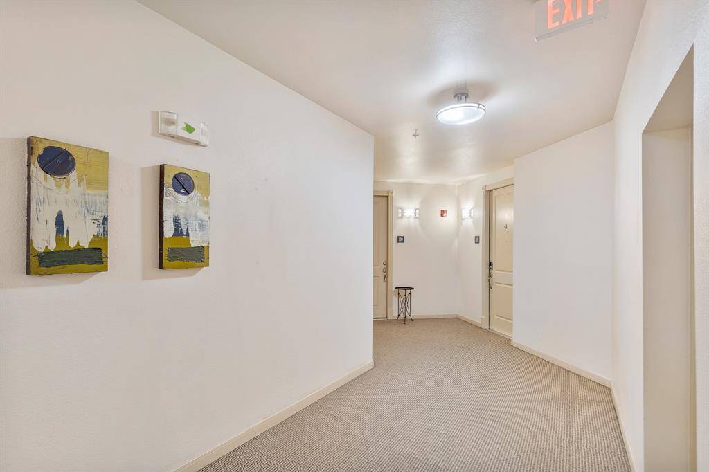Hallway to unit, exit door on right
