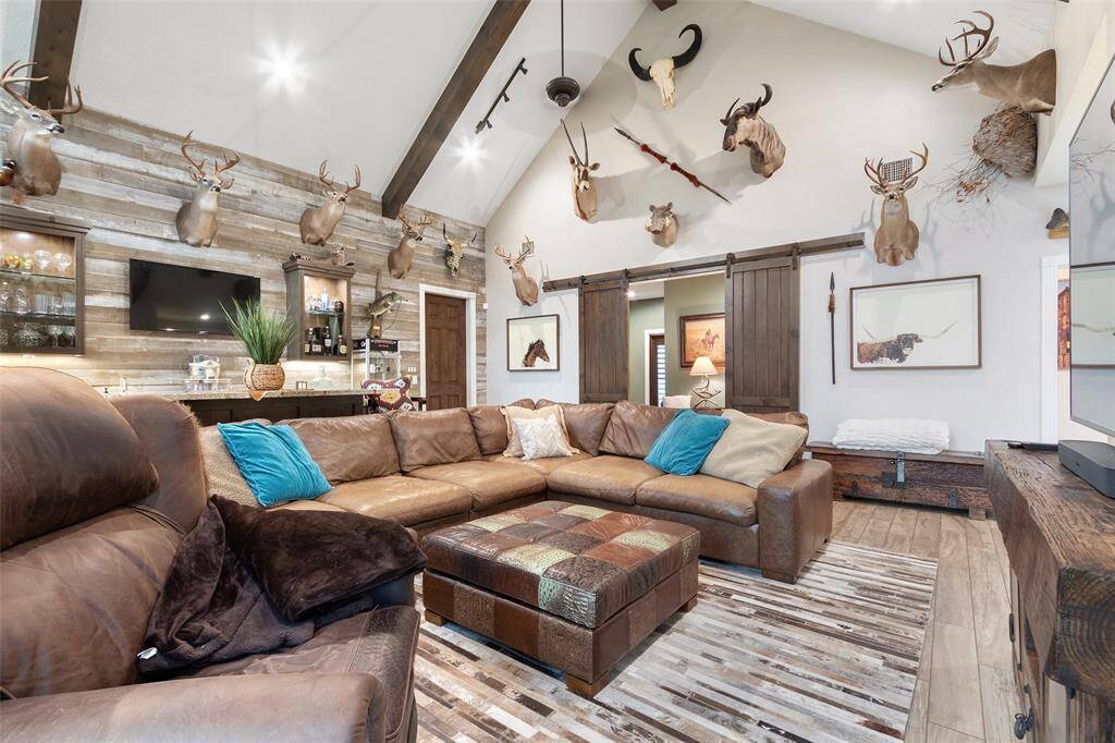 Another view of the game room that is complete with a wet bar for entertaining your guests.