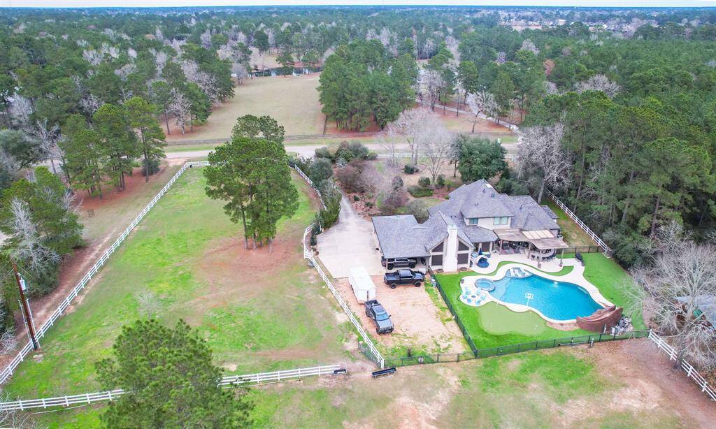 Another aerial view of the back of this house and large pool area.