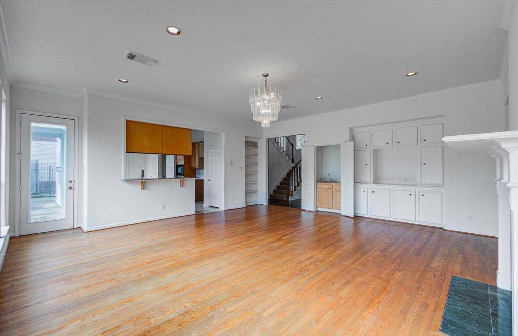 Spacious living room with lots of natural light and a fireplace