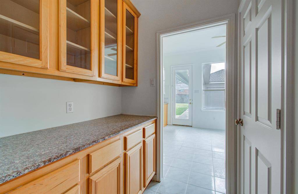 Extra storage between kitchen and formal dining for wine and beverages