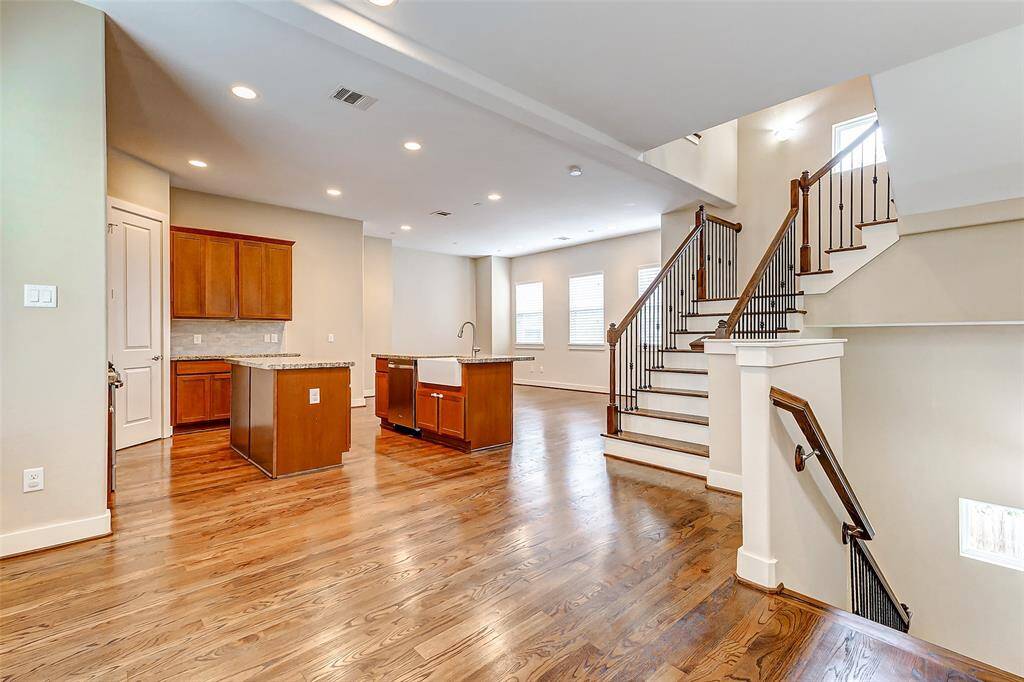 Enter second floor into open dining/kitchen and living area