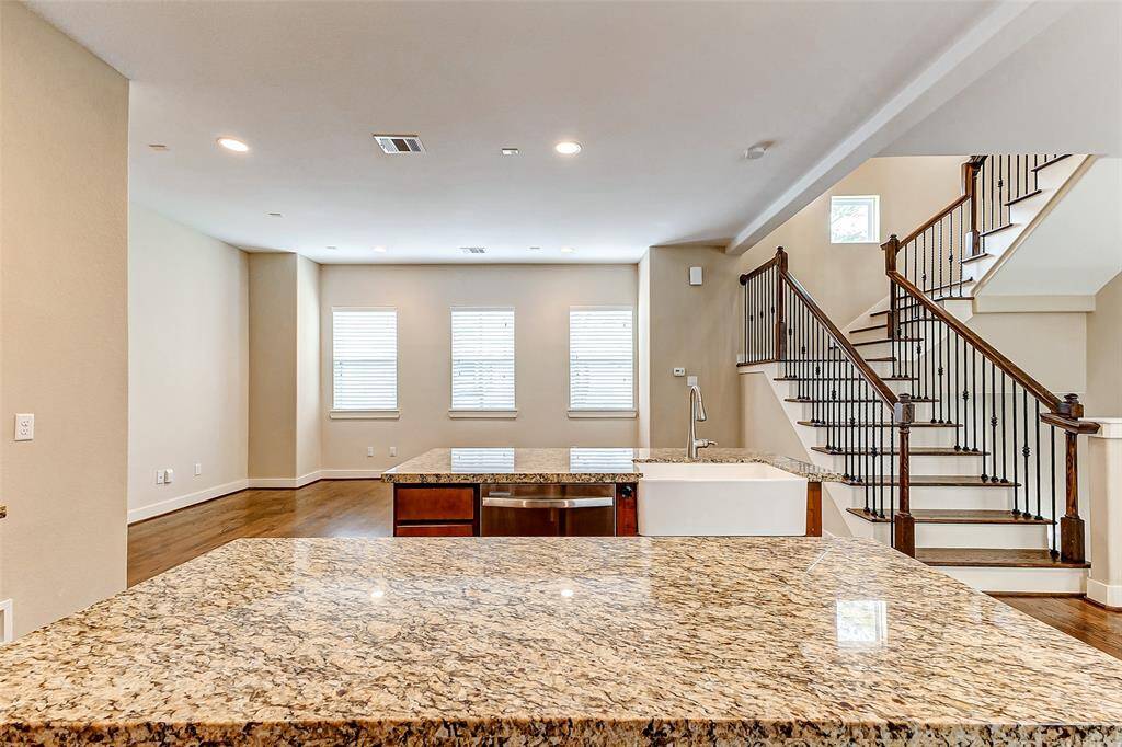 Looking over the beautiful porcelain sink and the wall of windows in the living room.
