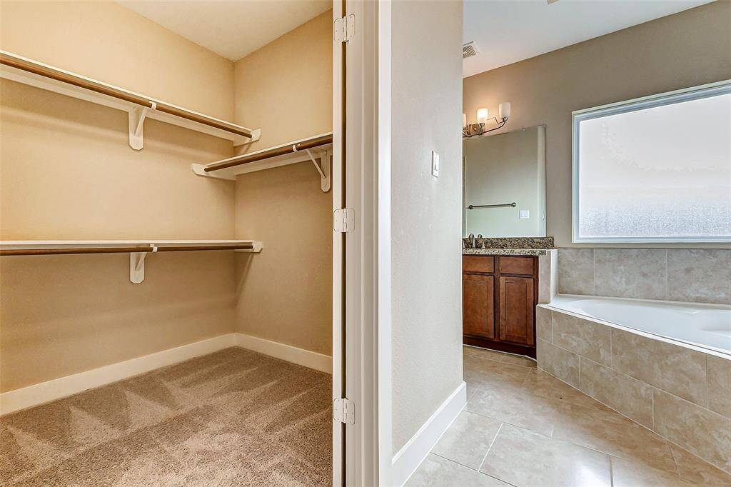 Walk-in closet in bathroom