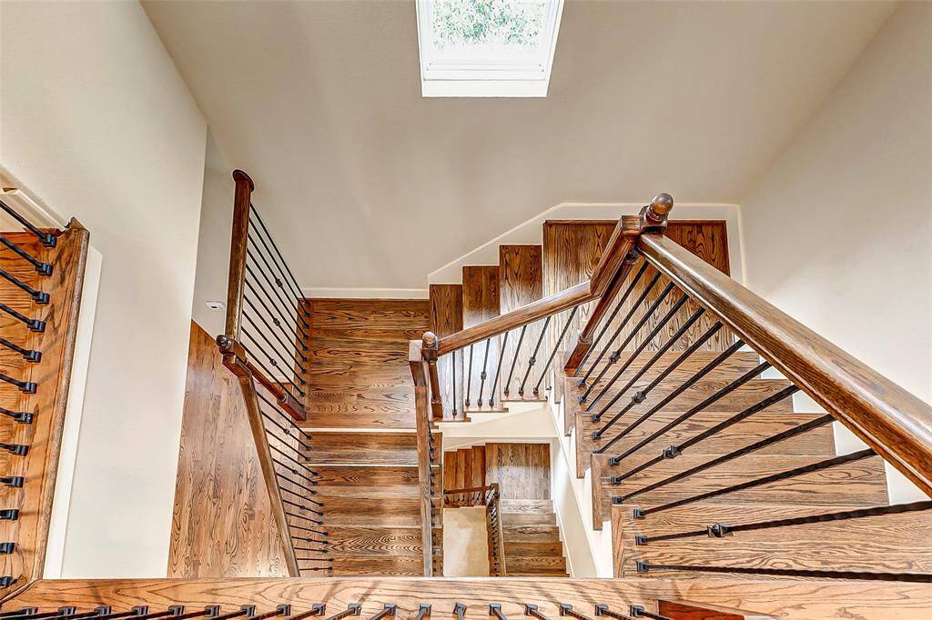 Beautiful wooden stairs with decorative wrought iron spindles-three floors