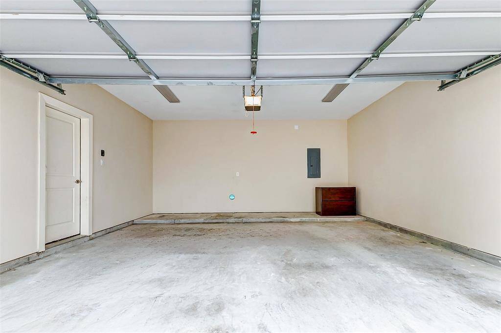 Two car garage with door opener; direct entry into house.