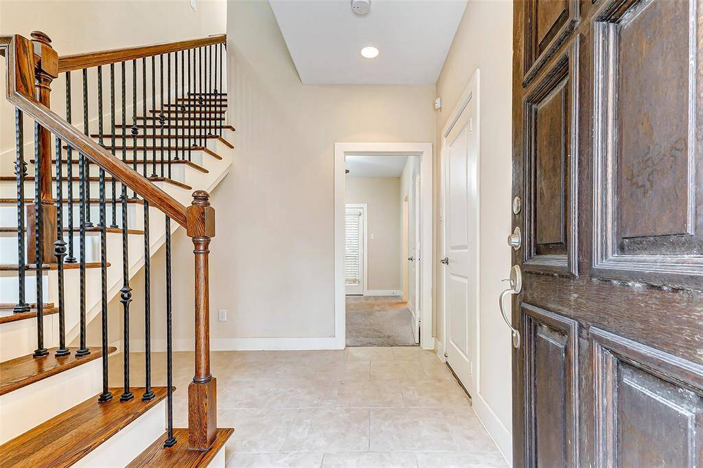 Foyer opens into bedroom or quiet, private office with full bathroom.