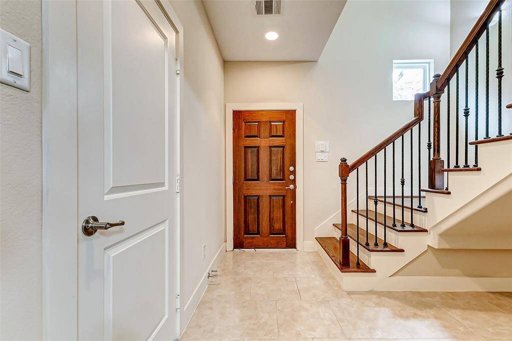 Both front door and garage door open into foyer.