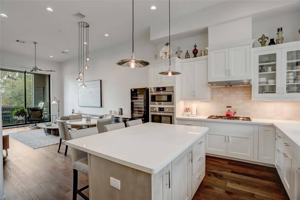 The sliding glass doors in the living room fully open up to this spacious covered patio.