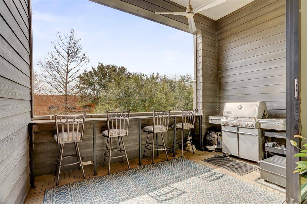 This covered patio has enough room for all your outdoor furniture and a large grill.
