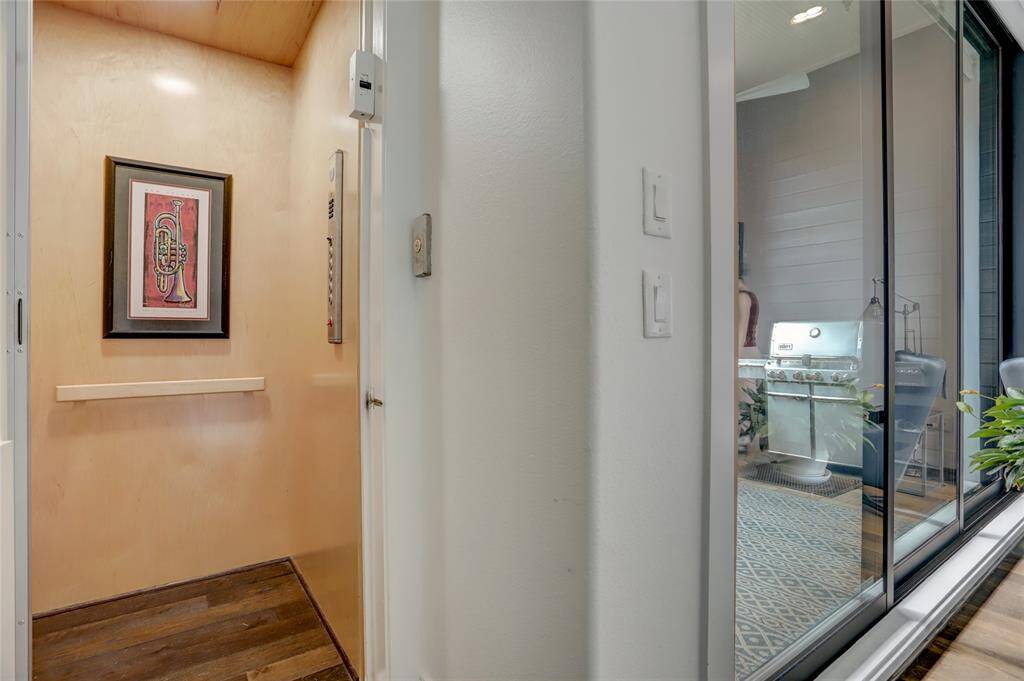 Never carry groceries up the stairs again! Here's a closer look at the elevator which extends through all four floors of this home.