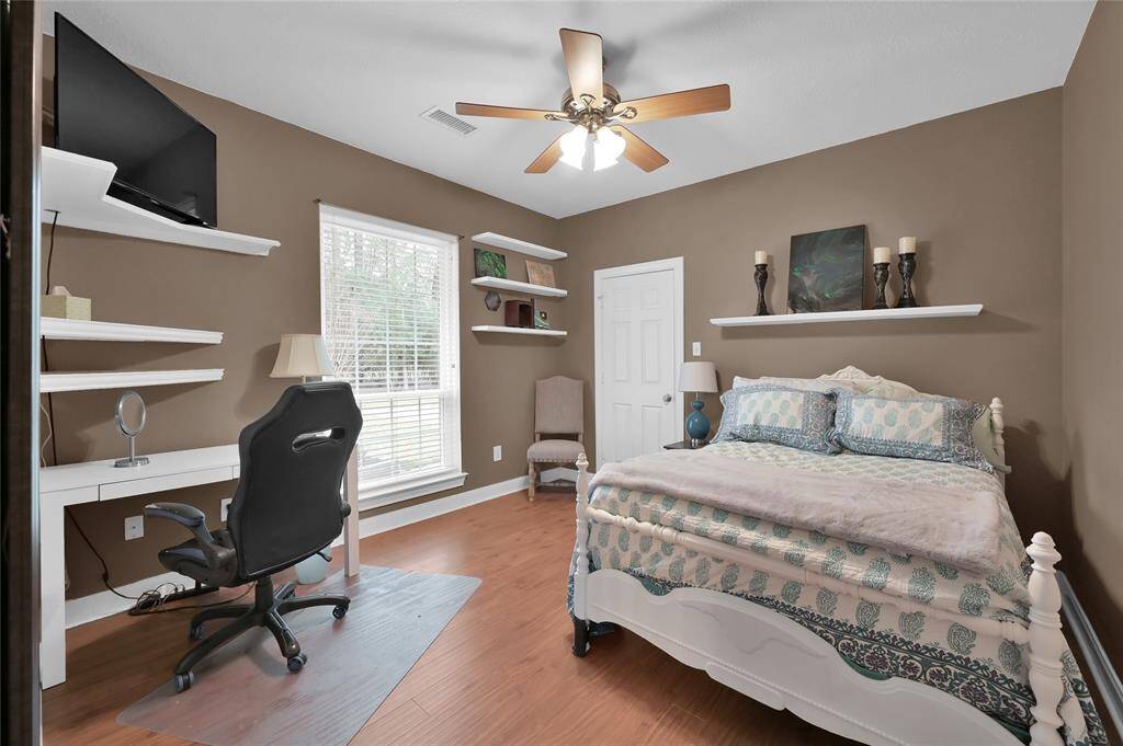 One of two bedrooms on the opposite side of the home that share a jack and Jill bath