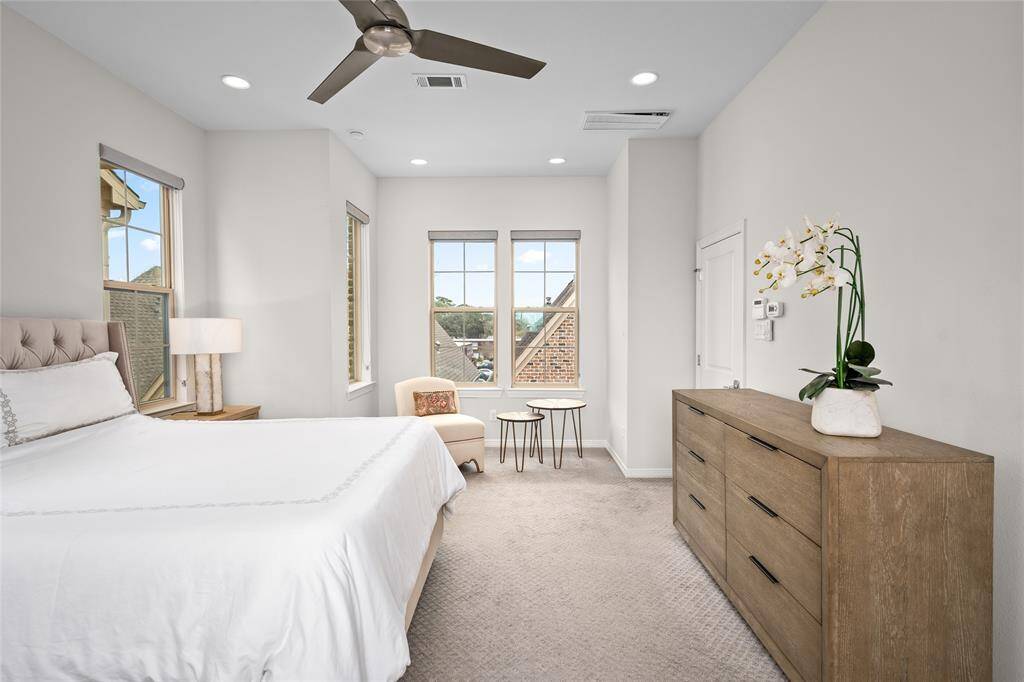 Another vista of the serene and peaceful primary bedroom. The sitting area beyond could be used to accommodate a crib or extra office niche.