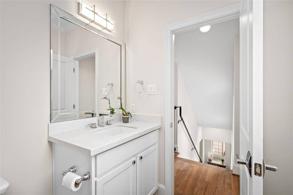 The powder bathroom on the second level is located across from the landing and central living/dining areas.