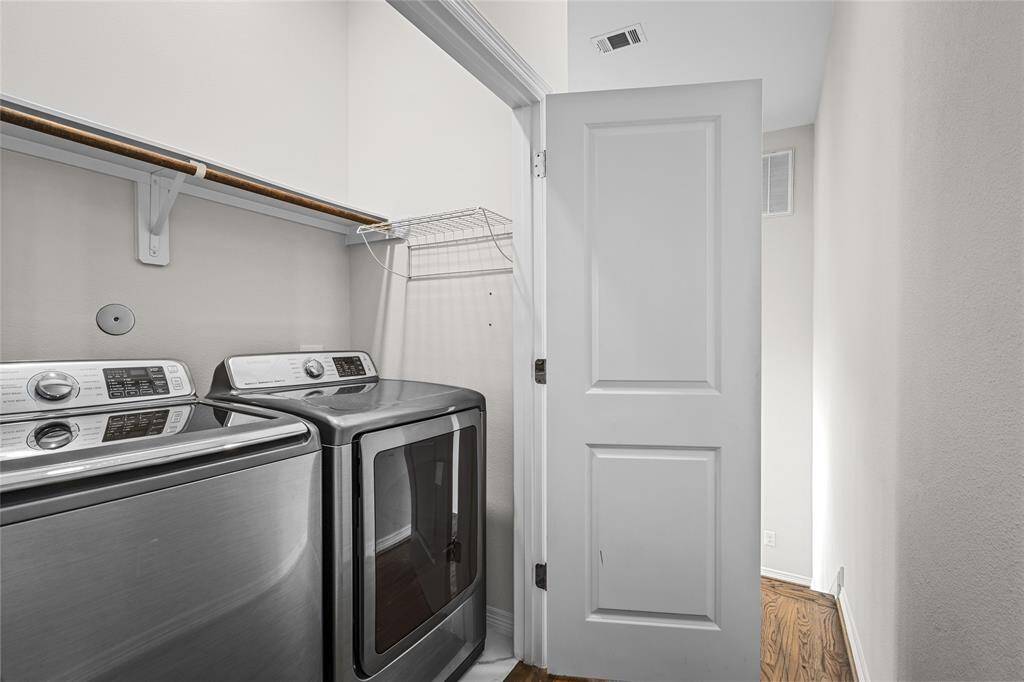 The utility closet is located on the third level in the hallway between the main bedroom and the second bedroom. Note: the washer and dryer are negotiable as non-realty items.