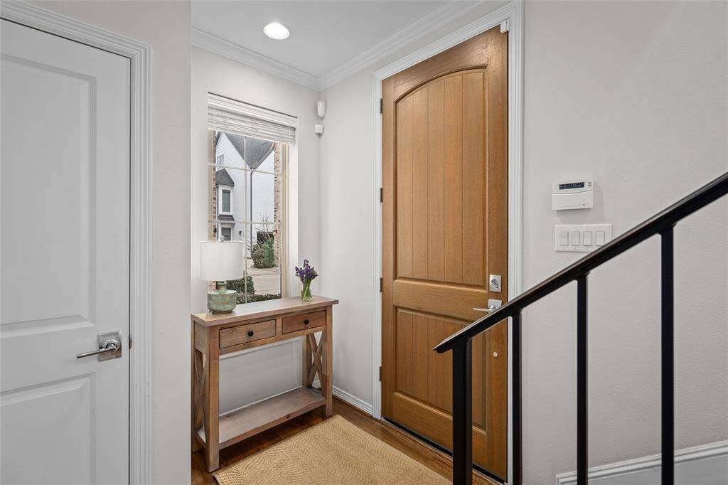 Nice-sized windowed foyer and deluxe two-paneled front door. Hall closet to the left. This is a perfect drop station for keys and mail.