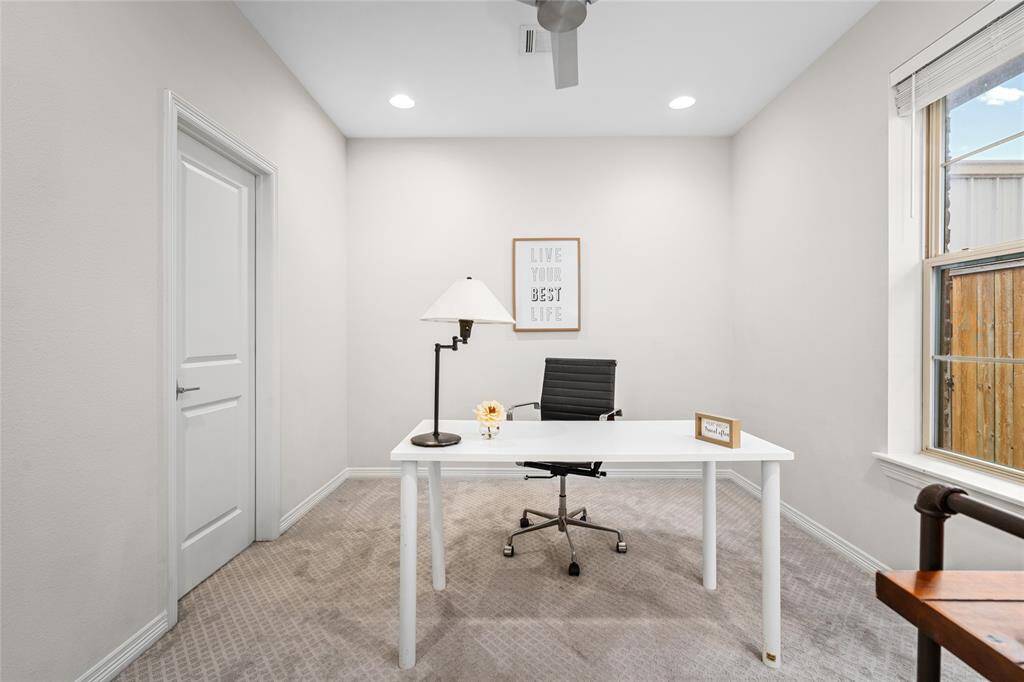 This downstairs suite has functioned as a work-from-home space. The full bath is behind the door to the right. Don't miss the modern ceiling fan and newly* steam-cleaned carpet throughout this fabulous home. *Feb. 2025 per Seller