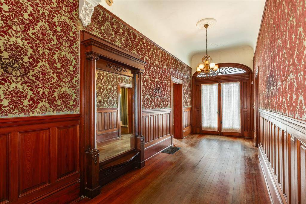 Notice the beautiful antique mirror on the East wall of the Grand Entry Hall.