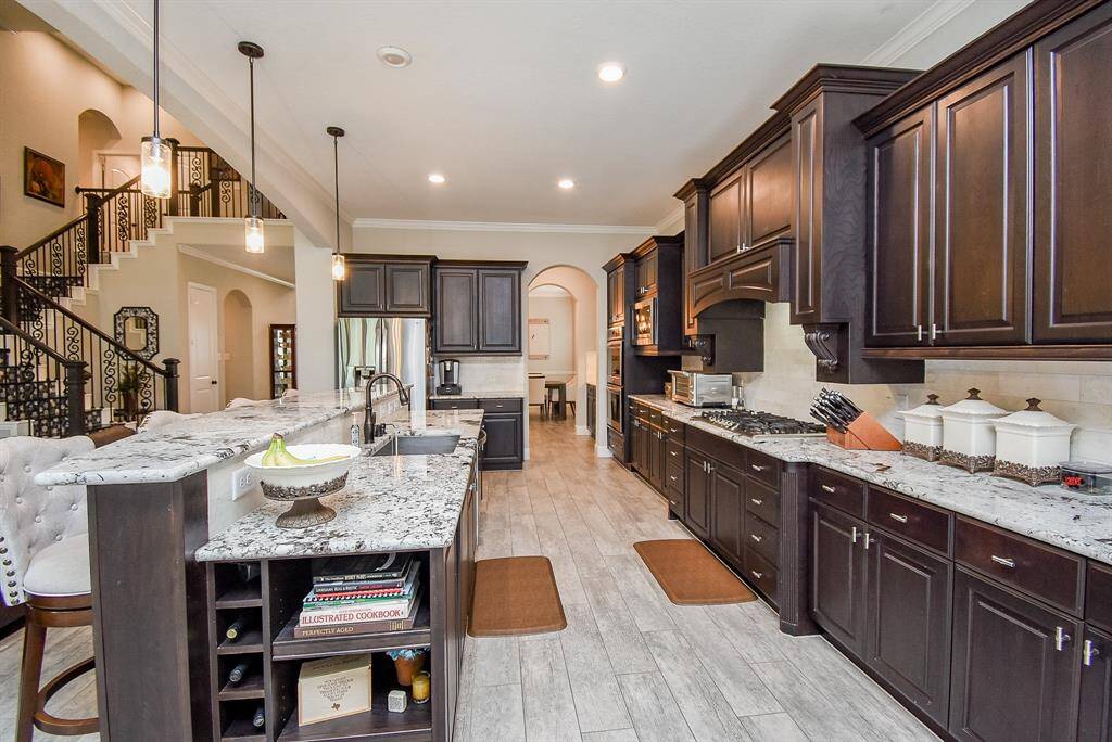 Another view of the kitchen with a lot of cabinetry
