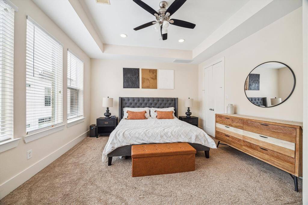 Escape to the spacious Primary Retreat located on the 3rd floor that features high ceilings, recessed lights within a trey ceiling, upgraded carpet, three large South facing windows & an oversized, walk in closet.