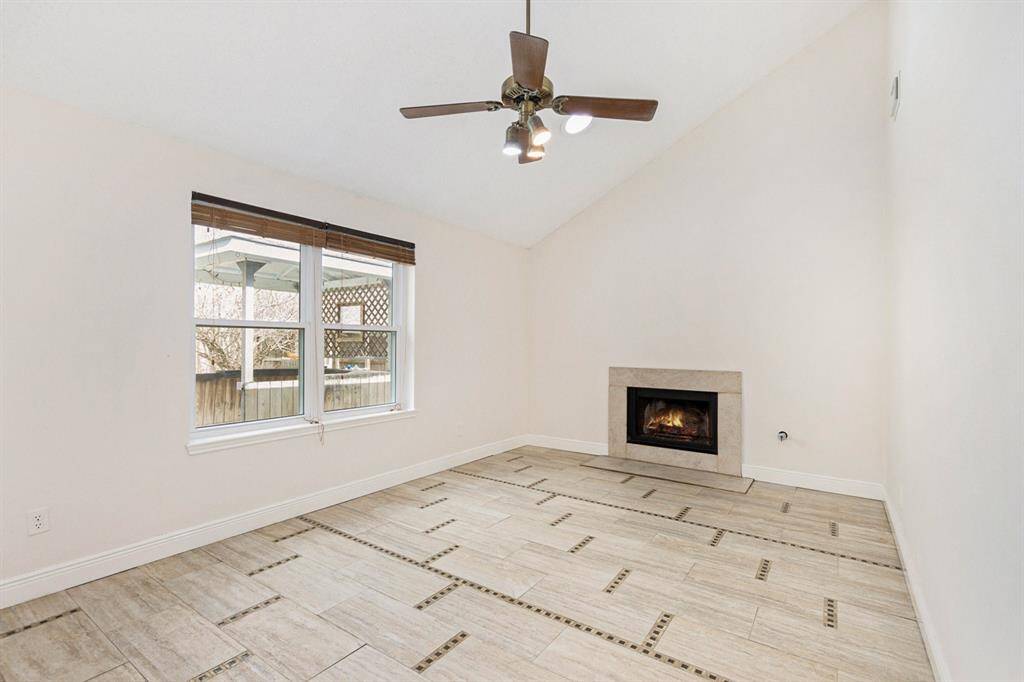 The living room also features a cozy fireplace.