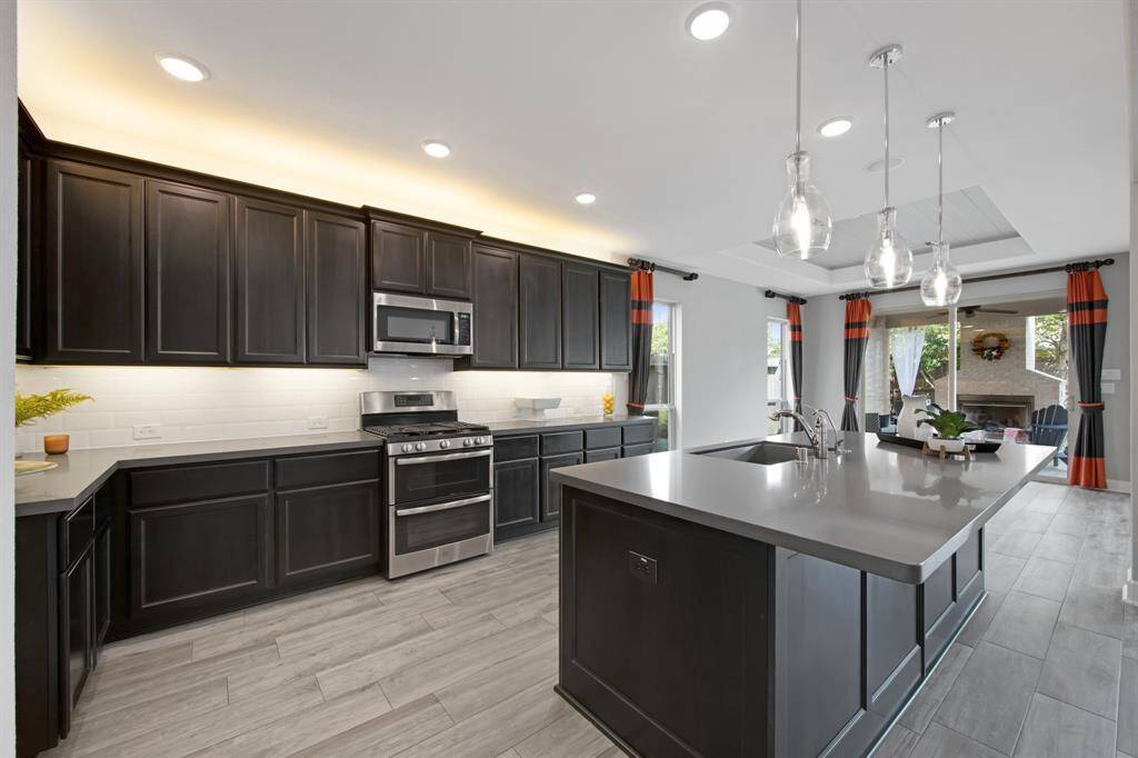 The kitchen is open to the breakfast/dining area as well as the living area: a true open concept floor-plan.