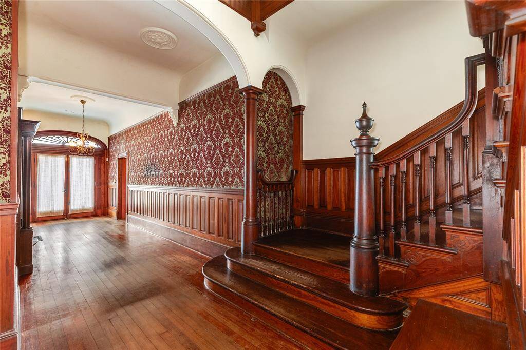 This view shows the arch on the West wall of the staircase sits jus above the bridal perch. This bridal perch wraps to the West and terminates on the other side (is currently enclosed in a closet that can easily be opened back up to reveal the full step).