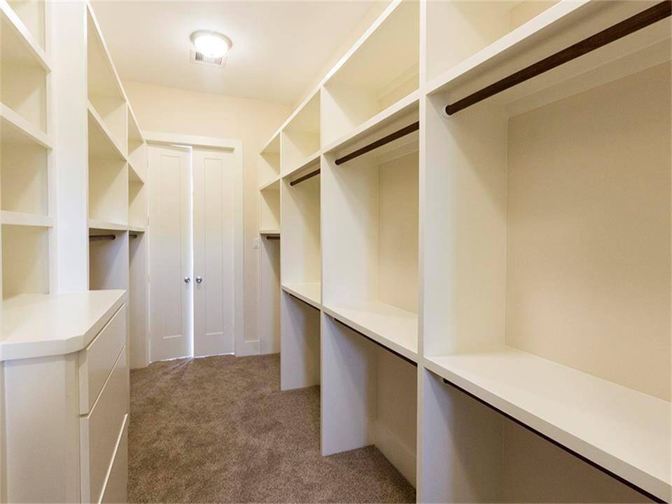 Custom walk in closet complete with built ins.
