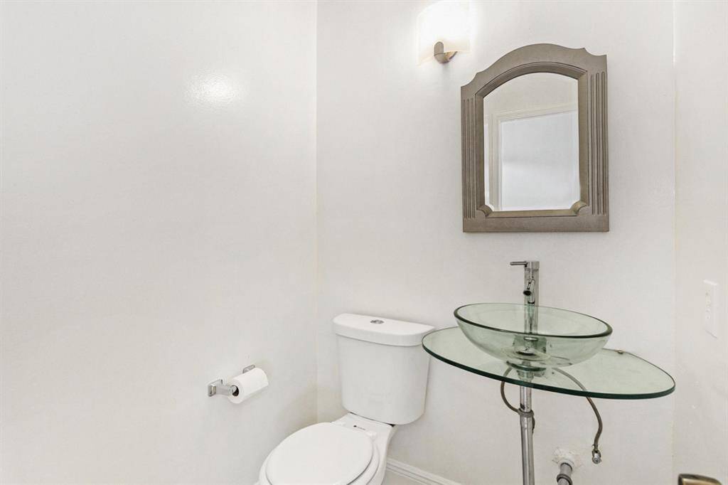 Half bathroom off the living room and kitchen.