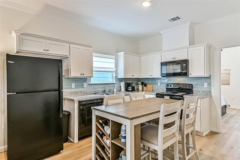 Stylish kitchen island enhances workspace and offers additional seating.