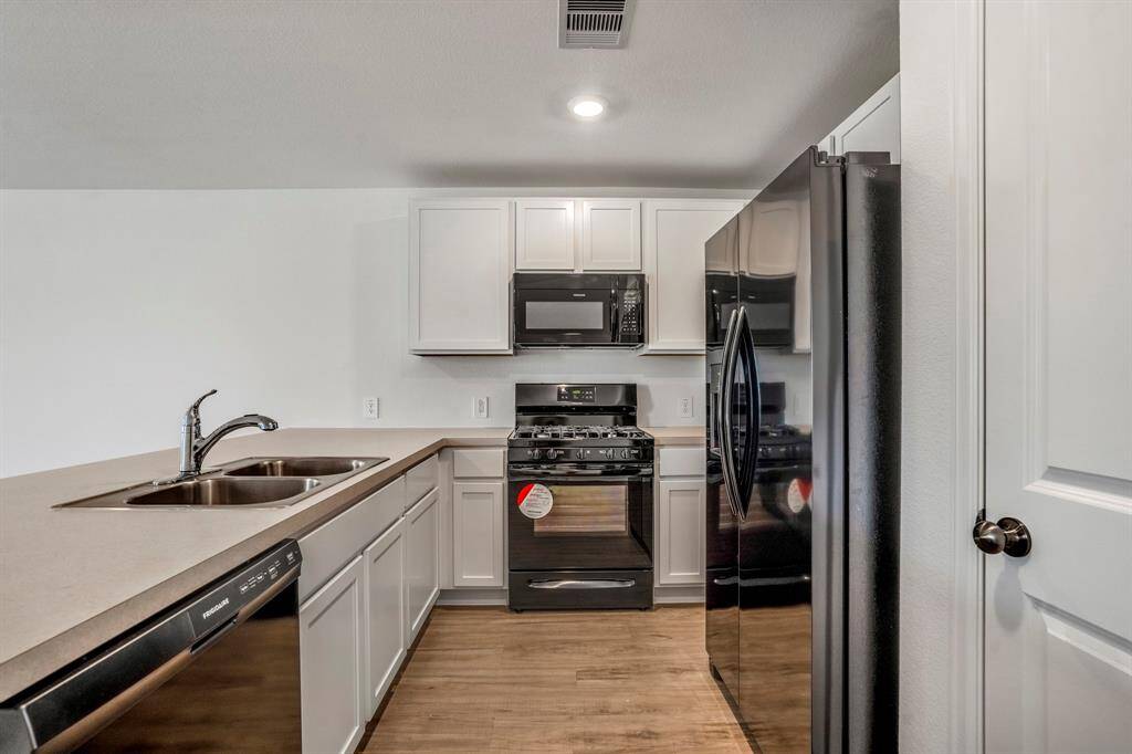 Lots of cabinets for storage.