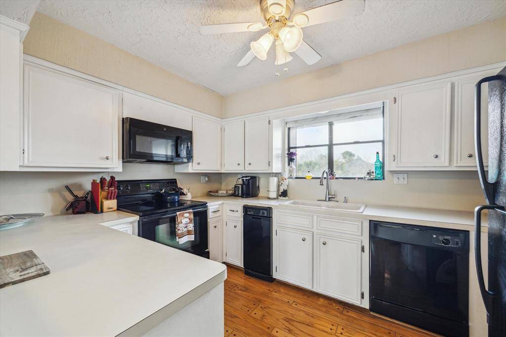 KITCHEN WITH WOOD FLOORS.