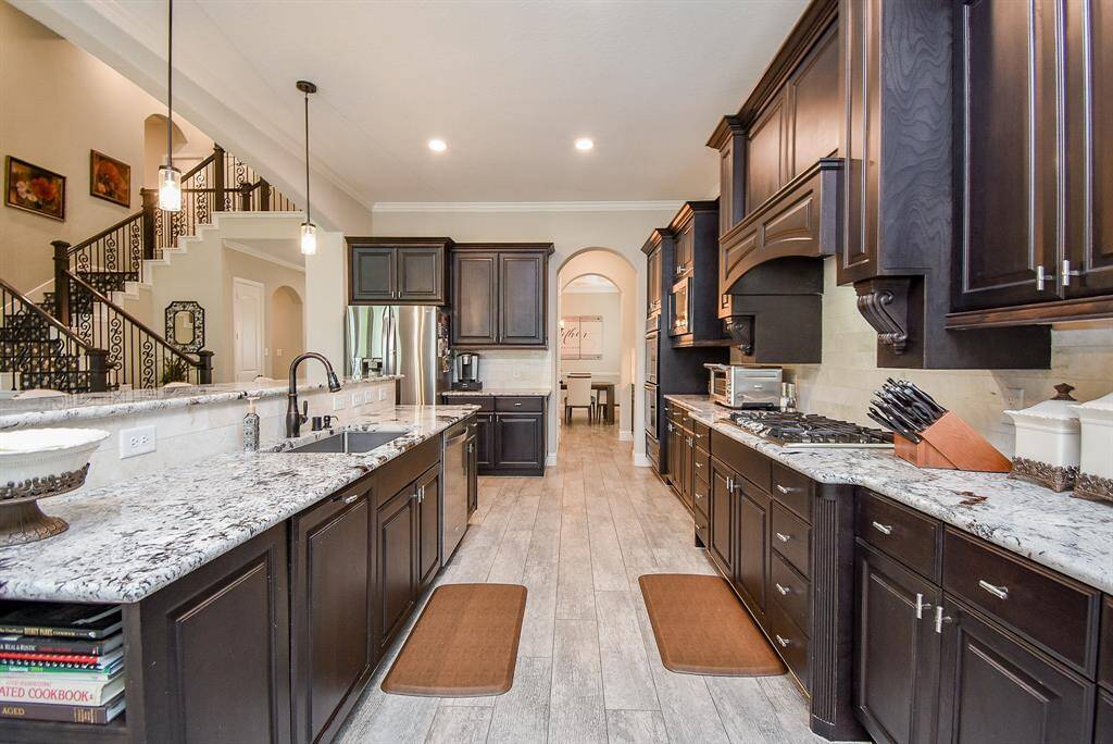 The seller has recently changed the kitchen backsplash, added a 3 drawer dishwasher, and replaced the microwave!
