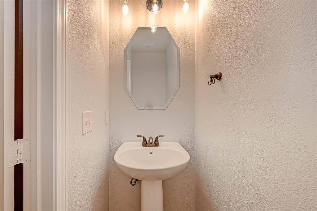 The half bathroom is conveniently located downstairs.