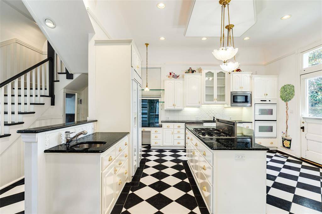 Convenience and timeless appeal. Double islands, one with a prep sink, double ovens, loads of custom cabinetry, and so much more.